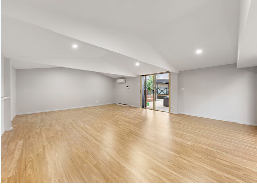 Spacious finished room with raked ceiling and new timber flooring