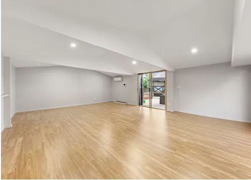 Spacious finished room with raked ceiling and new timber flooring