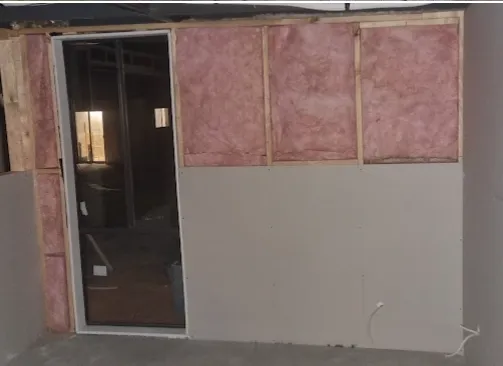 New wall being built with insulation and plasterboard